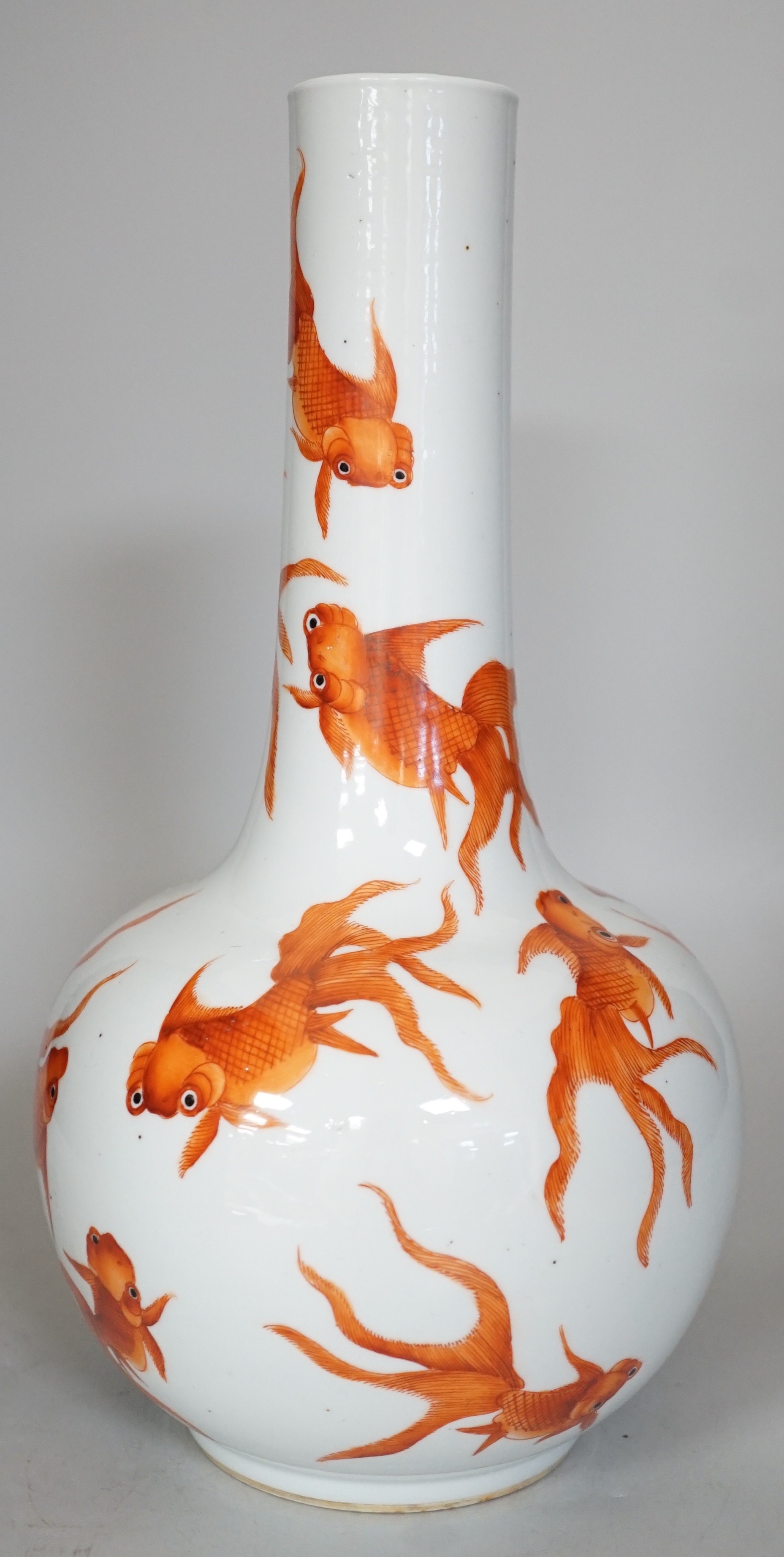 A Chinese iron red enamelled goldfish bottle vase. 35cm tall